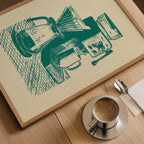 a framed illustration of a coffee-making setup, including a coffee maker, a cup, and a spoon, placed on a wooden table next to a cup of coffee.