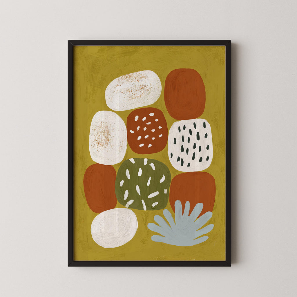 The image is a framed abstract art piece featuring a variety of colorful shapes and patterns, including circles, ovals, and splashes of color.