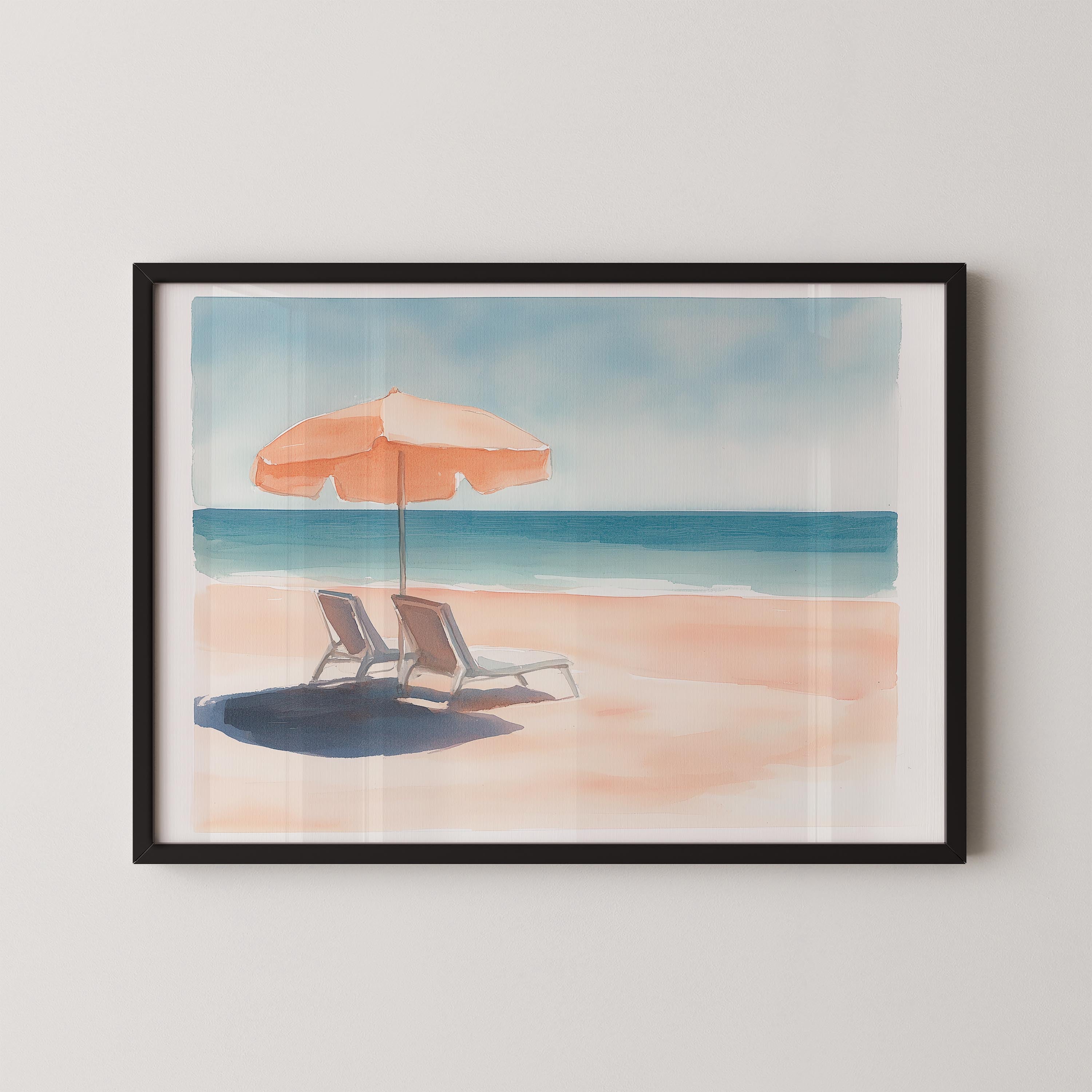 A framed watercolor painting depicting a serene beach scene with two lounge chairs under an orange umbrella, overlooking the ocean.