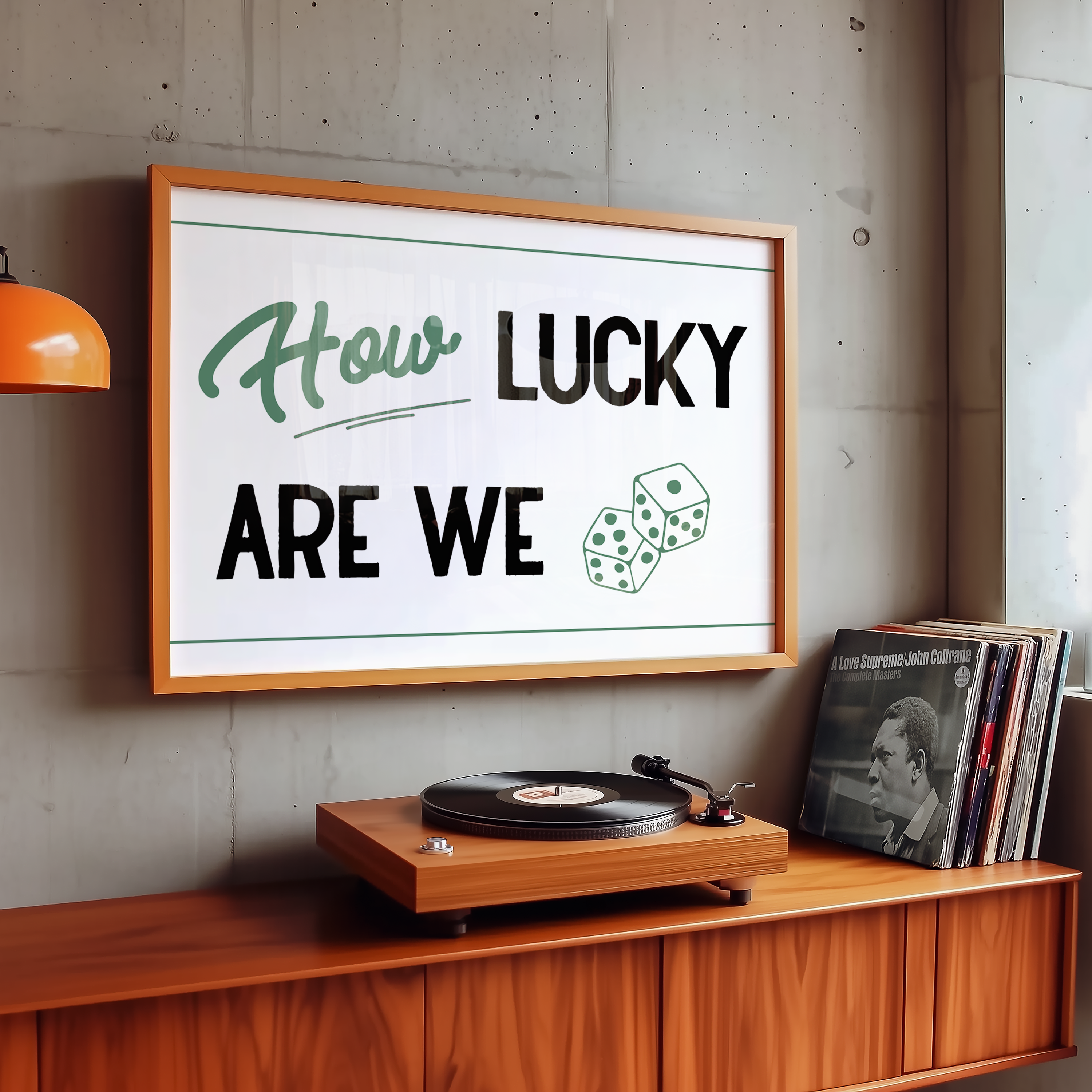 A framed poster with the text "How LUCKY ARE WE" hangs on a wall above a wooden record player and a collection of vinyl records.
