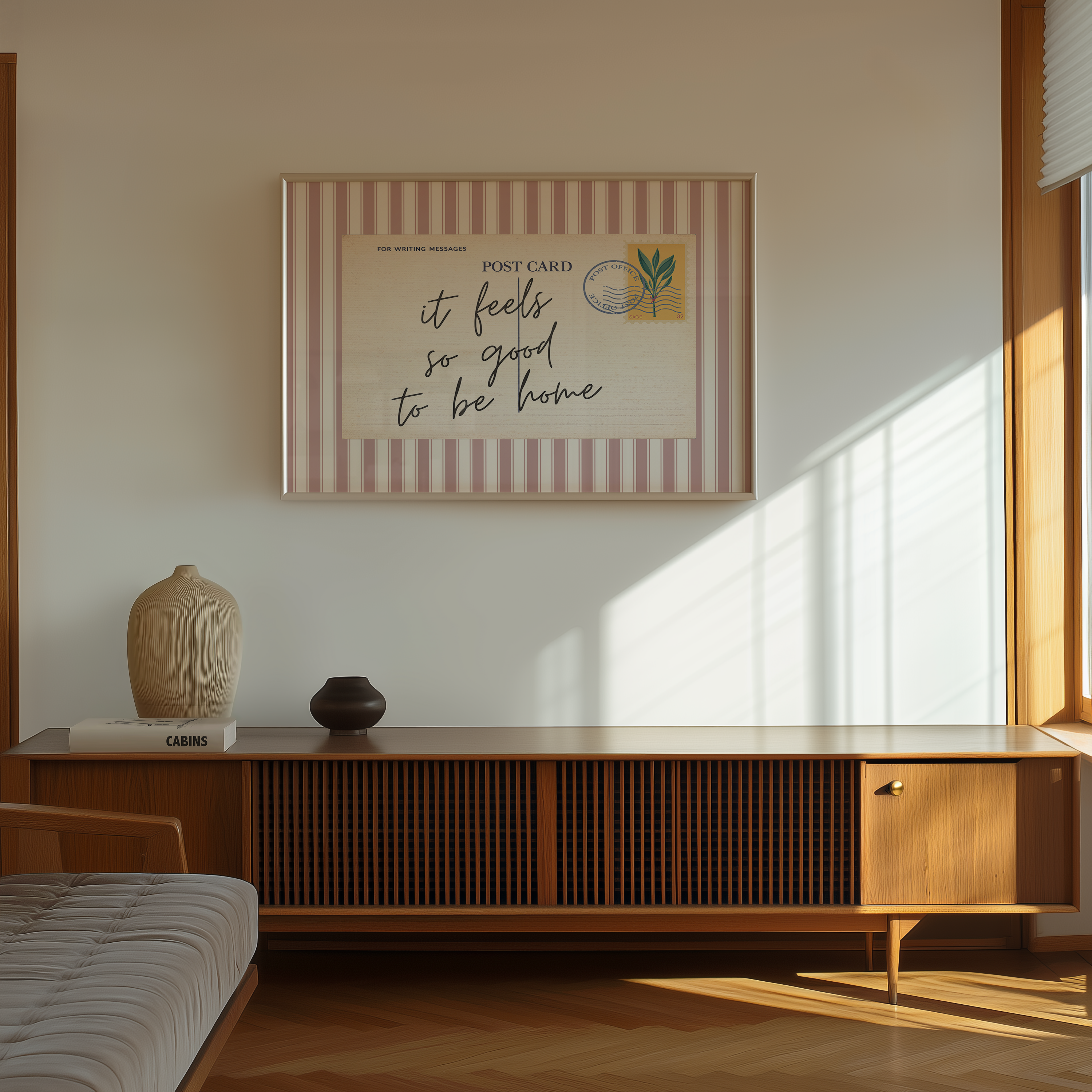 a minimalist living room with a wooden cabinet, a bed, and a framed poster on the wall.