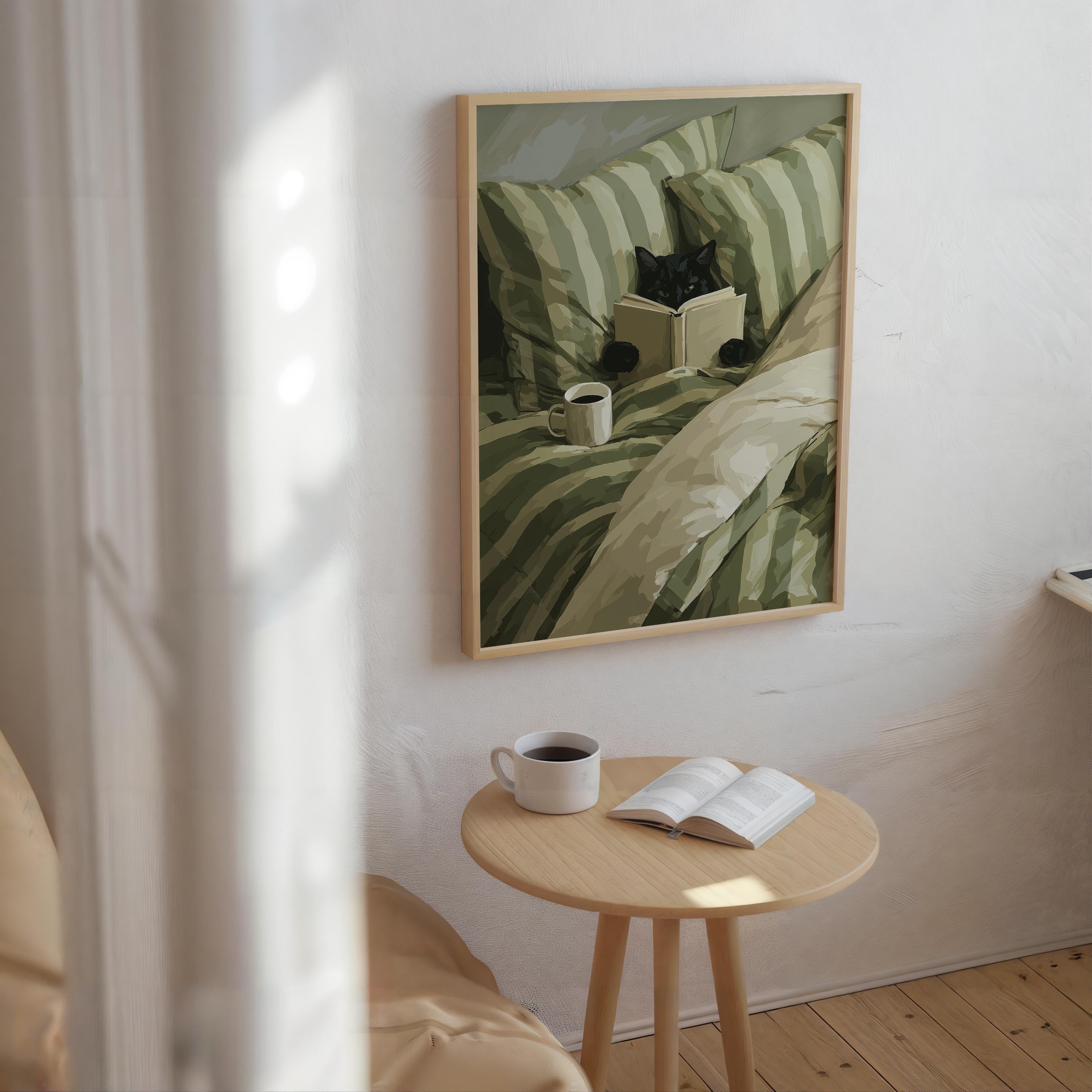 a cozy scene with a framed painting of a cat sitting on a bed, reading a book, and enjoying a cup of coffee. The painting is hung on a white wall above a small wooden table with a book and a cup of coffee on it.