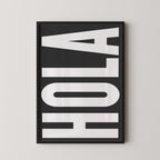 a large, bold, and white text that reads "HOLA" in a black frame.
