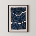 The image is a framed artwork featuring a striking abstract design with wavy lines in shades of blue and white.