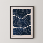 The image is a framed artwork featuring a striking abstract design with wavy lines in shades of blue and white.