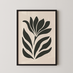 a framed artwork of a stylized plant or flower design in black and white.