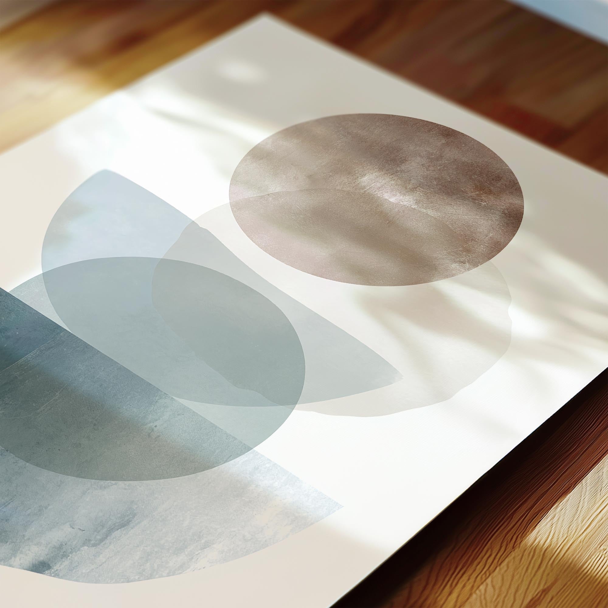 abstract art with various shades of blue and brown shapes, including circles and curved lines, arranged on a white background.
