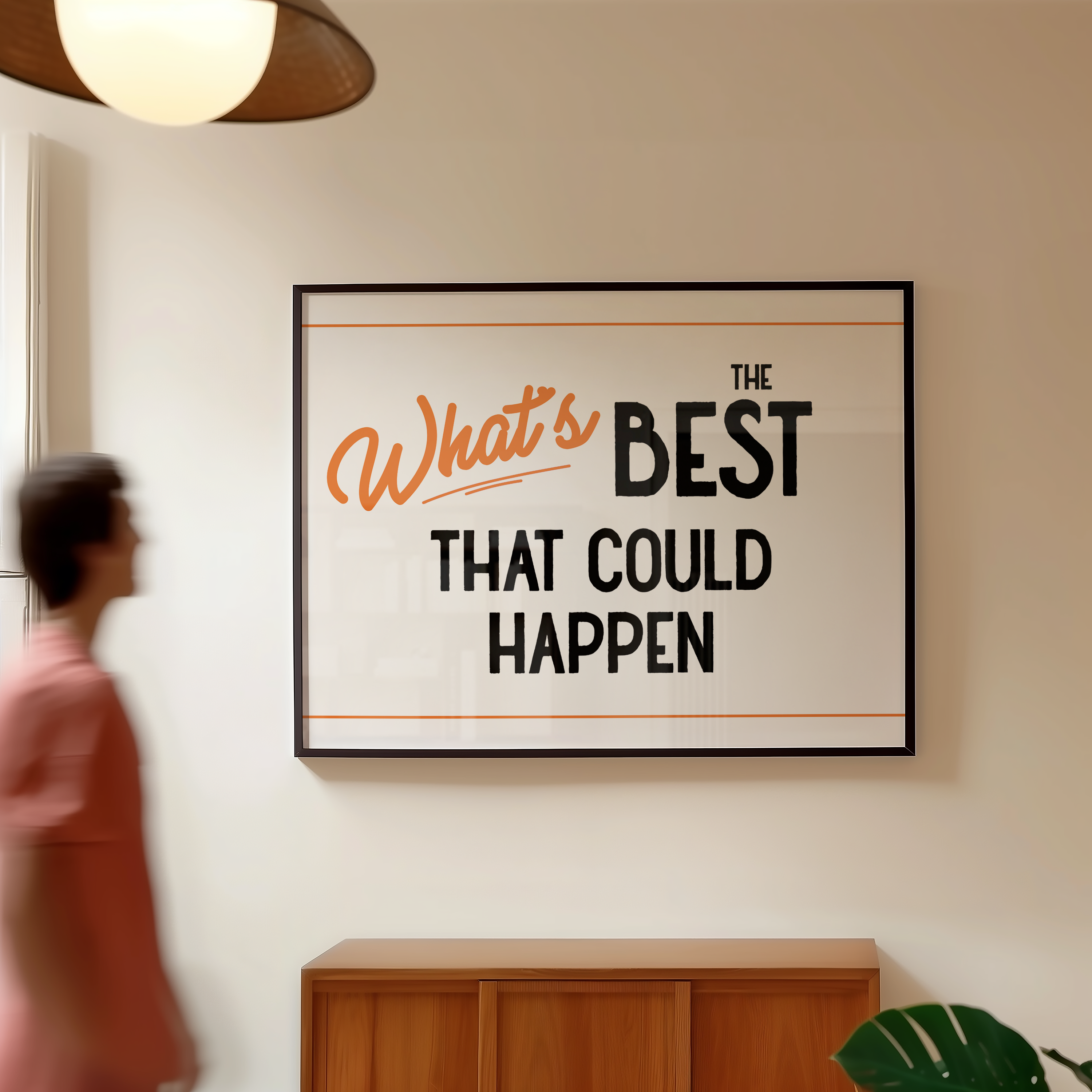 a person walking past a framed poster with the text "What's BEST THAT COULD HAPPEN" displayed on the wall.