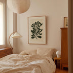 a cozy bedroom with a large bed, a lamp, and a framed artwork on the wall.