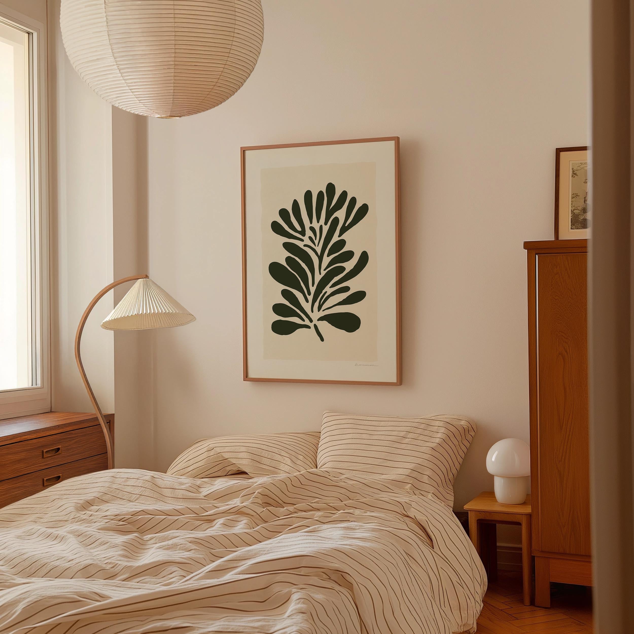a cozy bedroom with a large bed, a lamp, and a framed artwork on the wall.