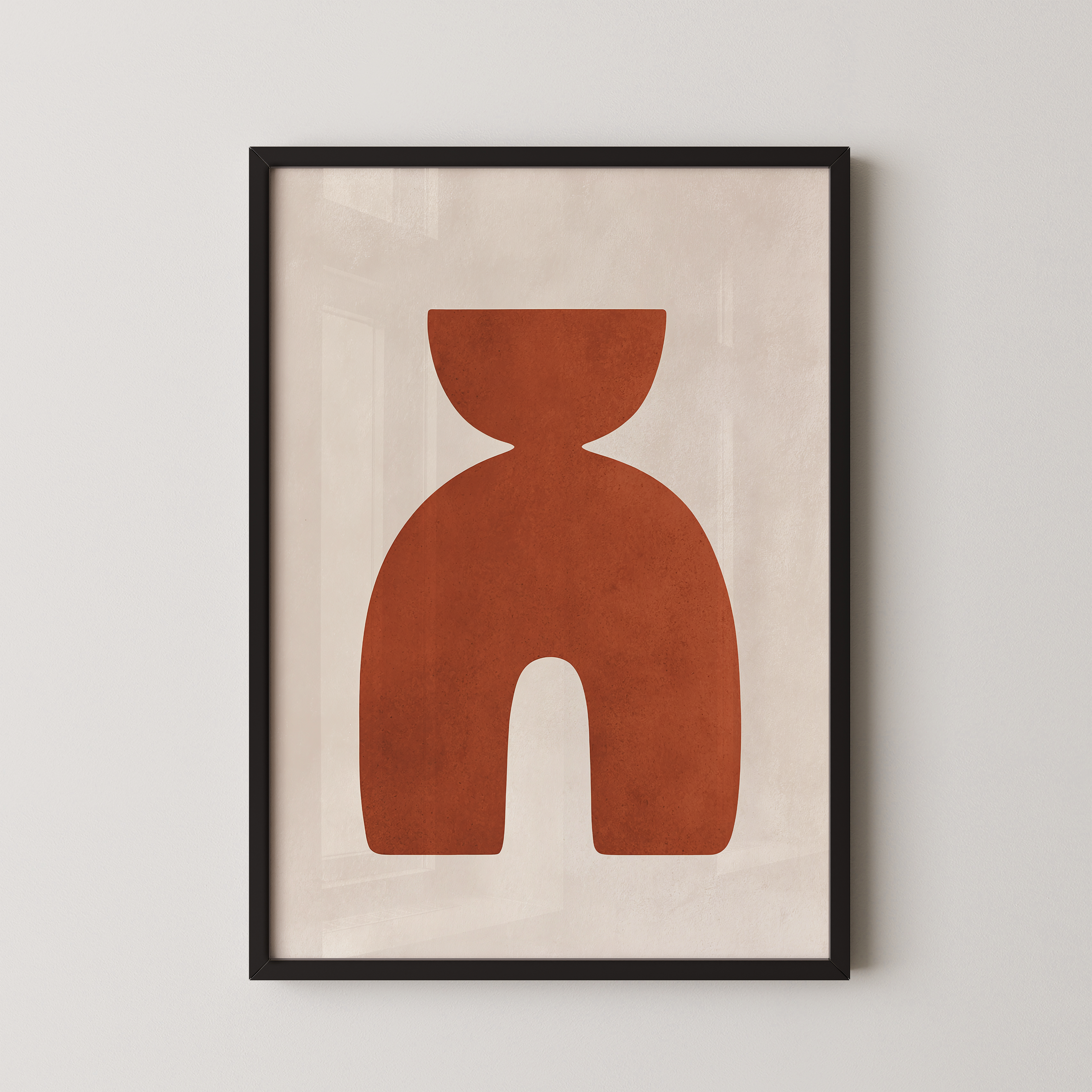 a framed abstract art piece with a large, stylized orange shape.
