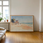 a large framed painting of a beach scene with a lifeguard tower, people, and a clear blue sky.