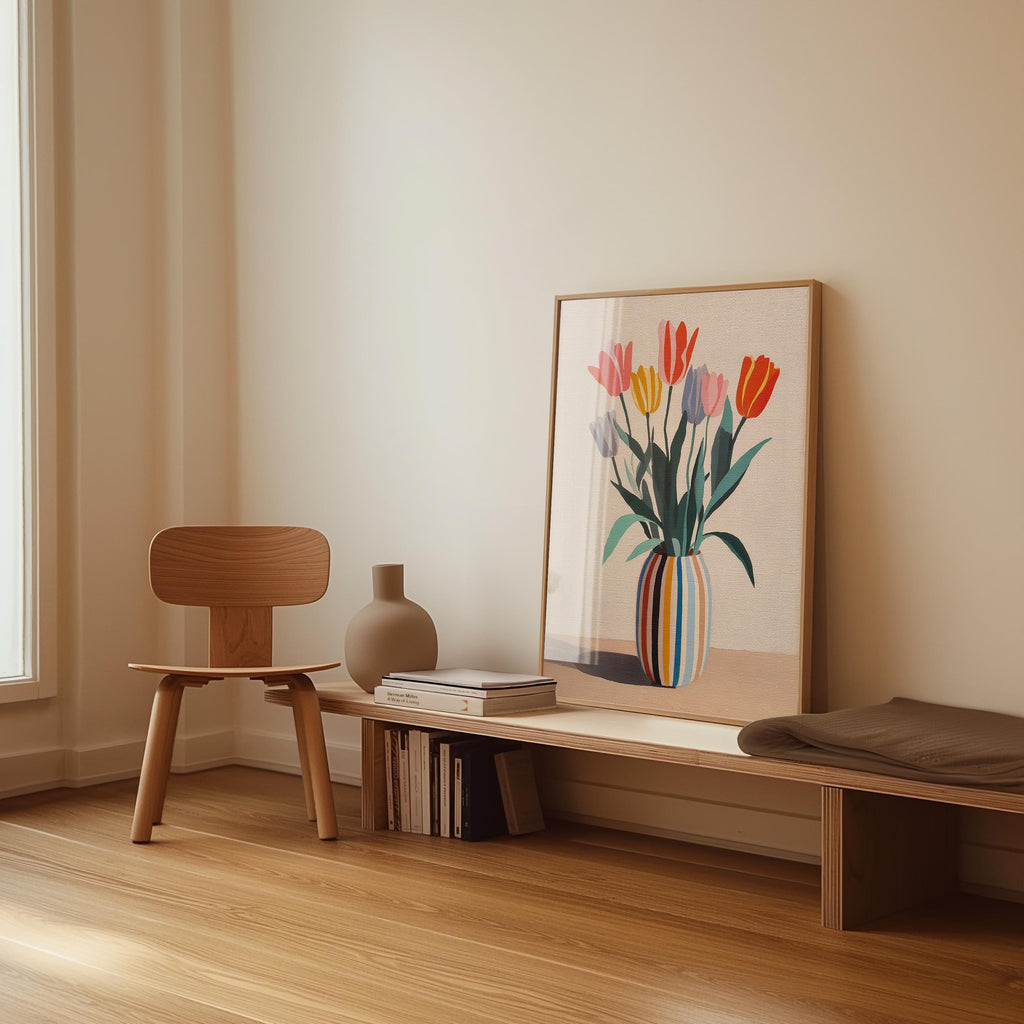 a wooden chair, a wooden bench, a vase, and a framed picture of a colorful flower arrangement on a wall.