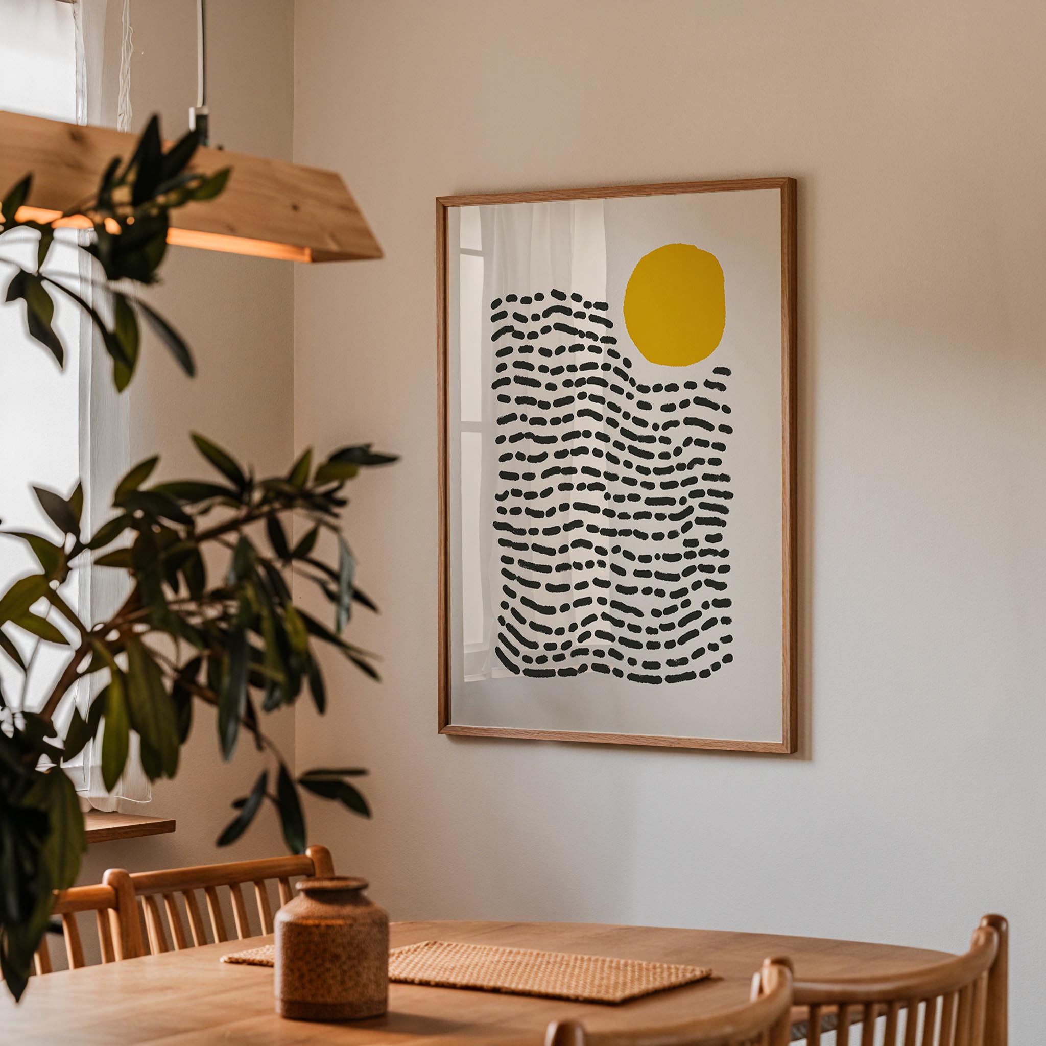 a wooden dining table with a vase on it, and a framed abstract art piece hanging on the wall above the table.