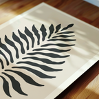 a close-up view of a leaf-like design on a white background.