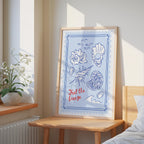 a framed poster with illustrations of seashells and a message that says "Feel the breeze".