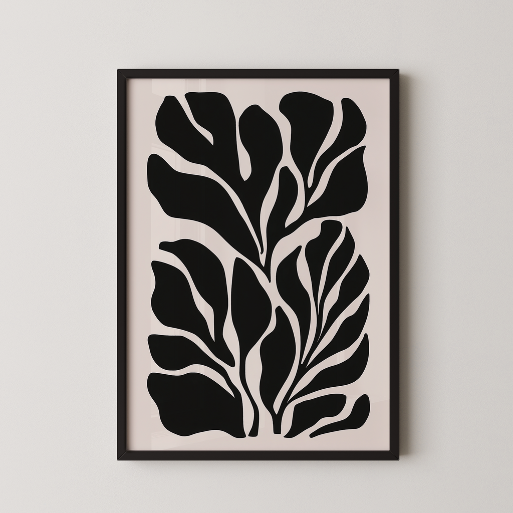 The image is a framed artwork featuring a striking black and white abstract design of stylized leaves or plant-like shapes.