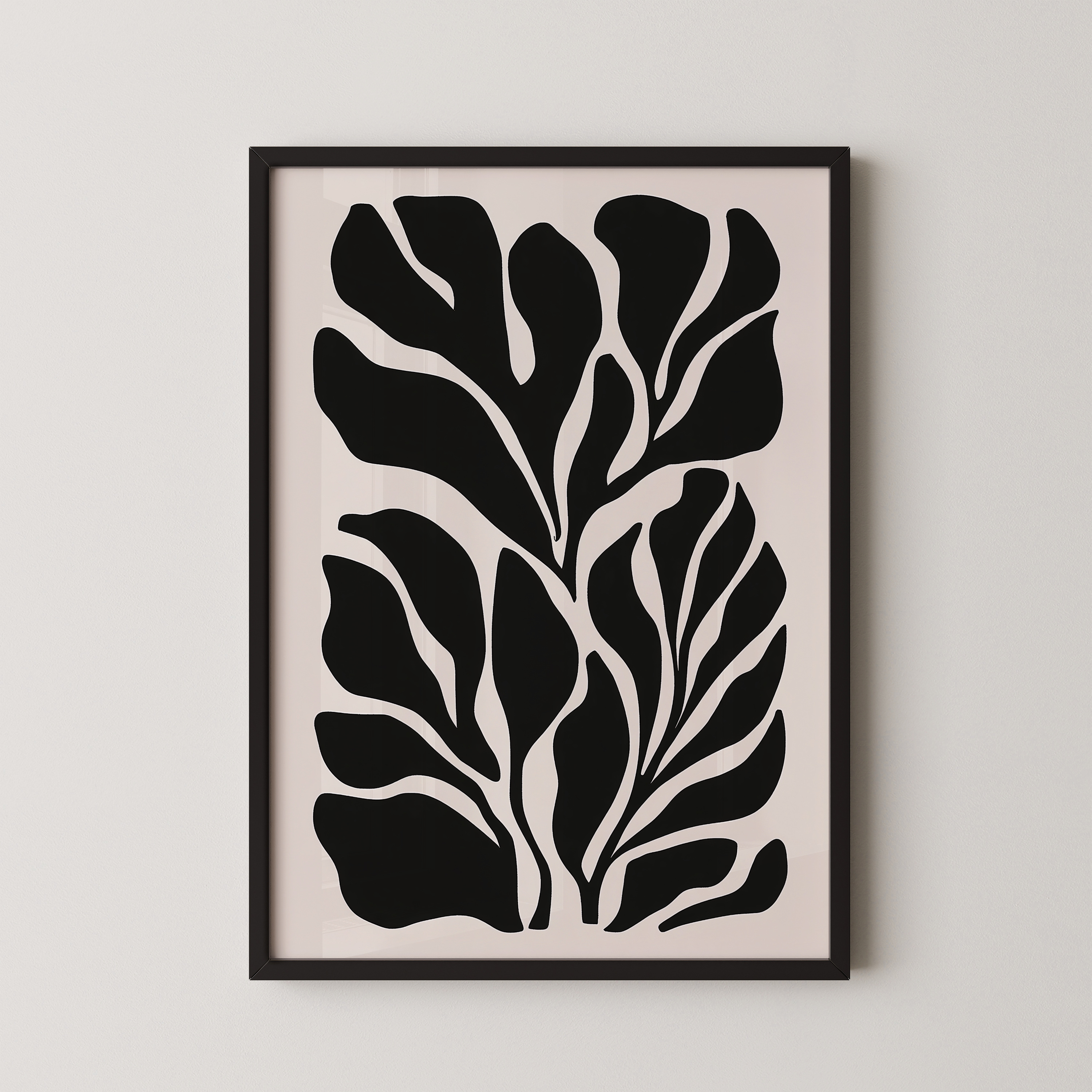 The image is a framed artwork featuring a striking black and white abstract design of stylized leaves or plant-like shapes.