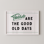 a framed poster with the text "These are the good old days" in a simple, bold font.